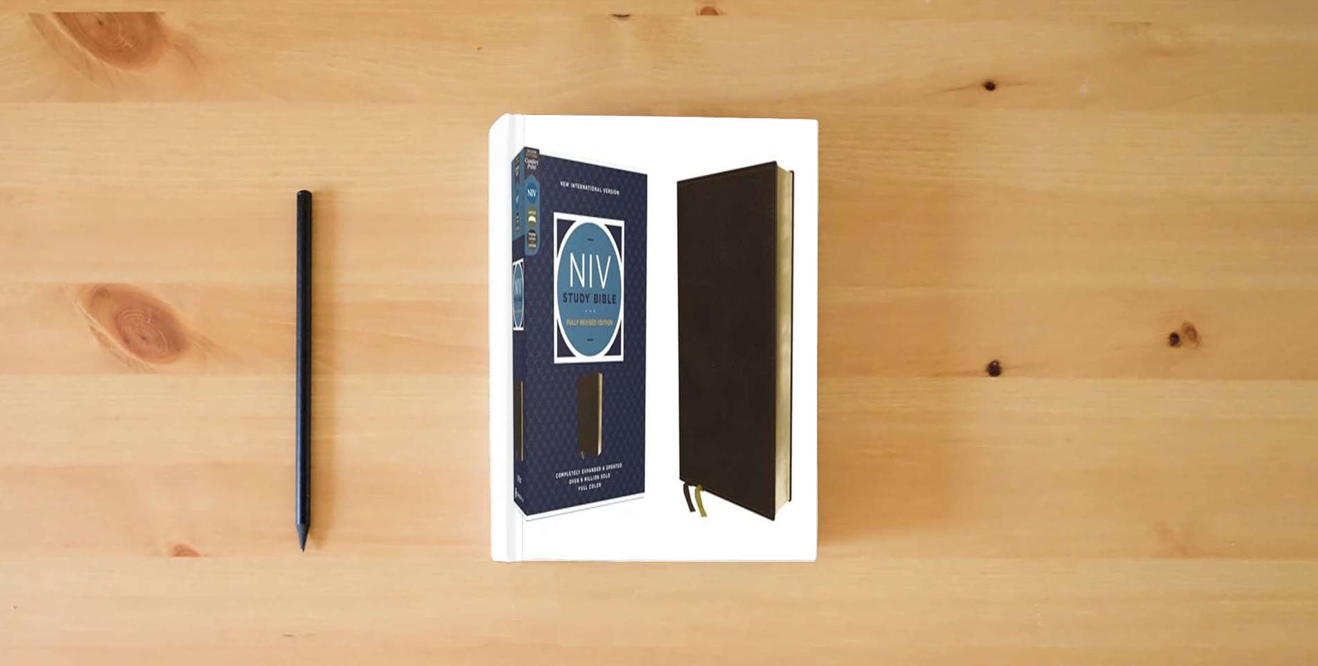 The book NIV Study Bible, Fully Revised Edition (Study Deeply. Believe Wholeheartedly.), Genuine Leather, Calfskin, Brown, Red Letter, Comfort Print is on the table