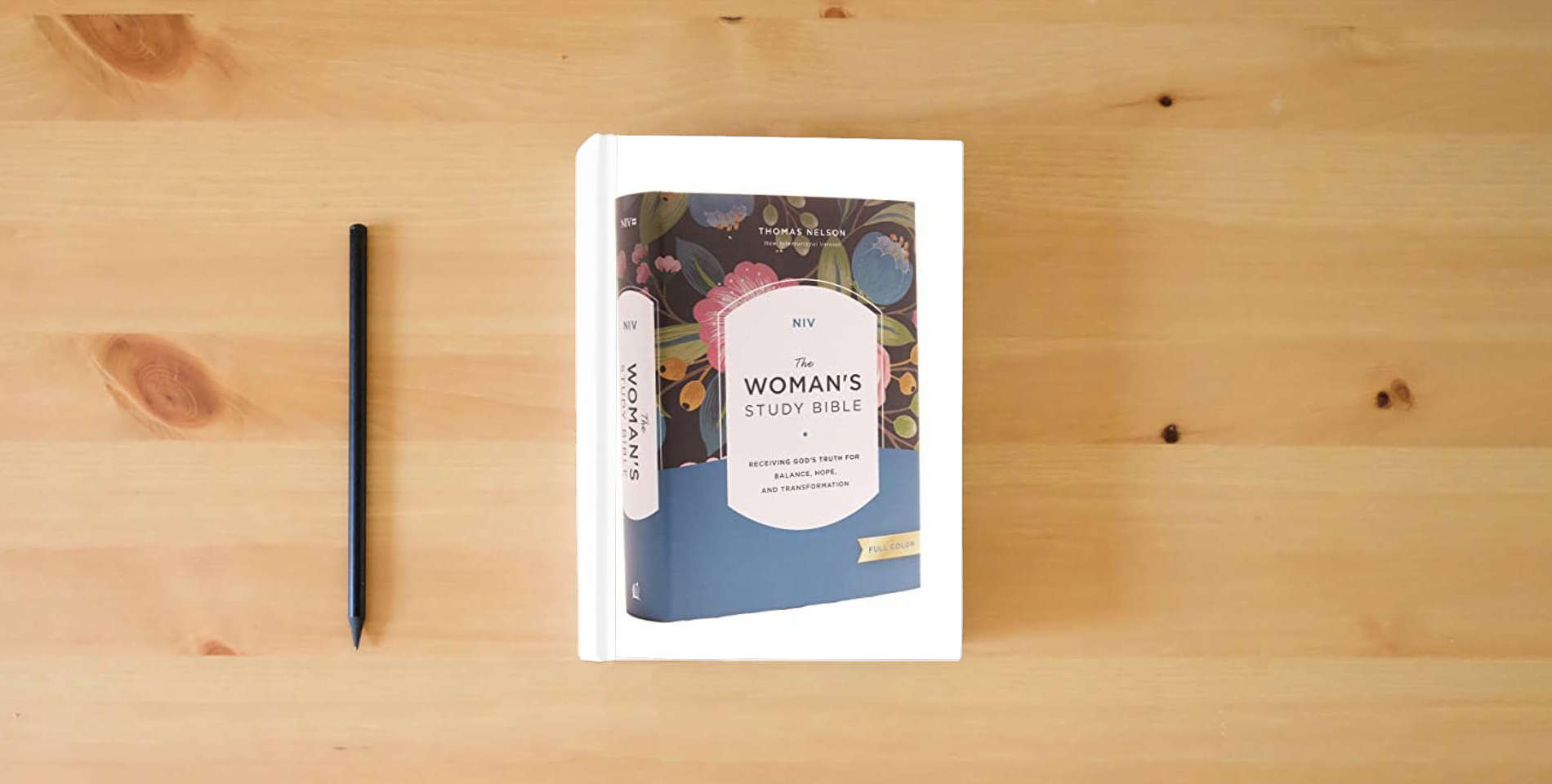 The book NIV, The Woman's Study Bible, Hardcover, Full-Color: Receiving God's Truth for Balance, Hope, and Transformation is on the table