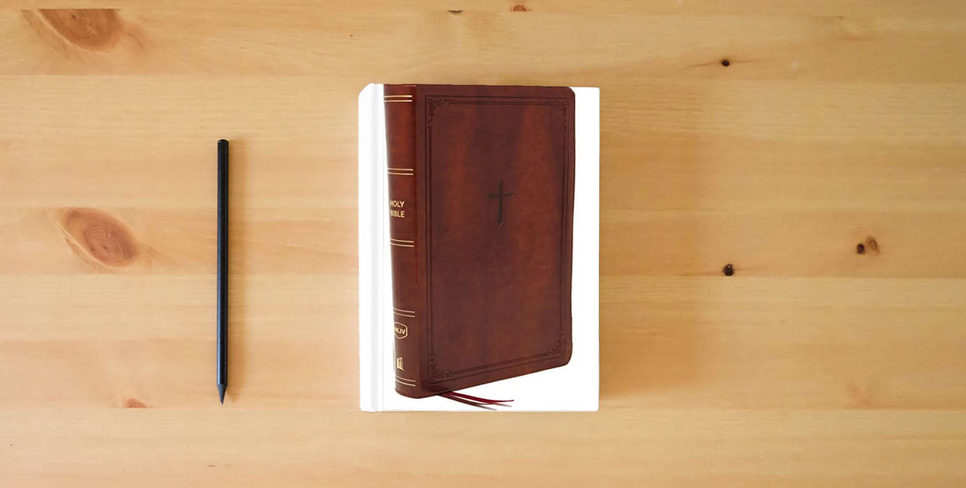 The book NKJV, End-of-Verse Reference Bible, Personal Size Large Print, Leathersoft, Brown, Red Letter, Comfort Print: Holy Bible, New King James Version is on the table