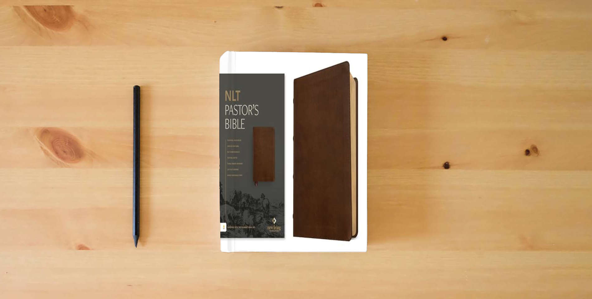 The book NLT Pastor's Bible, Filament Enabled (LeatherLike, Brown, Red Letter) is on the table