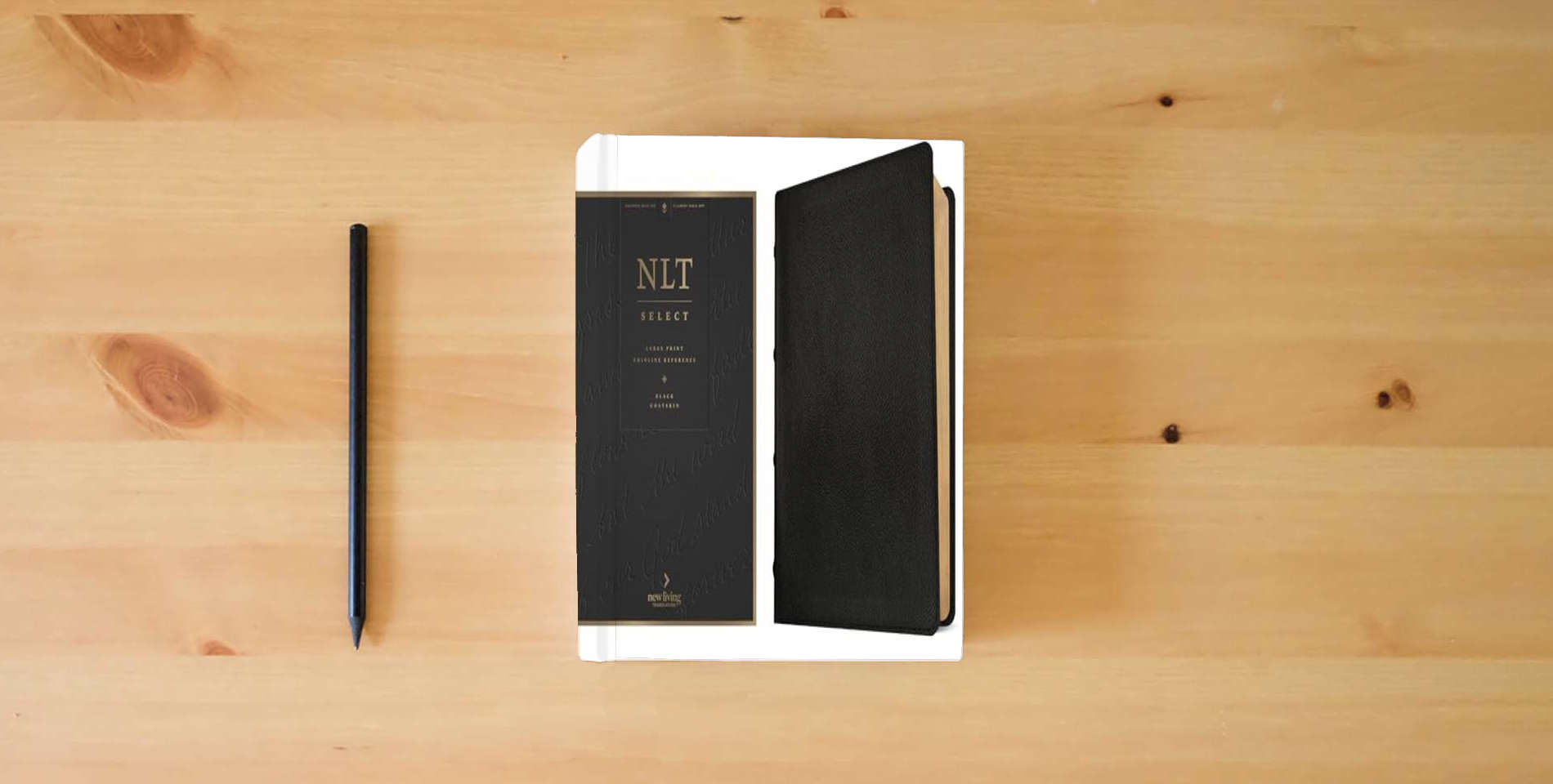 The book NLT Select Large Print Thinline Reference Bible, Filament Enabled (Goatskin Leather, Black, Red Letter) is on the table