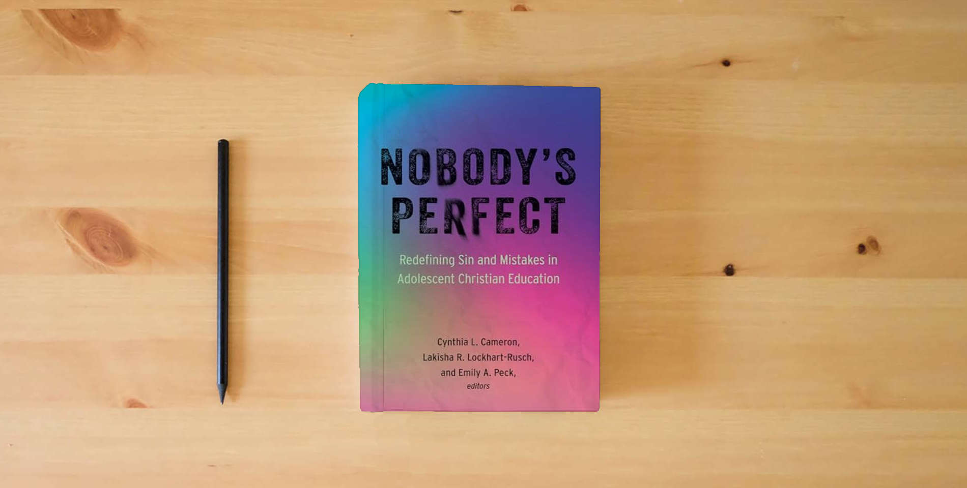 The book Nobody's Perfect: Redefining Sin and Mistakes in Adolescent Christian Education is on the table