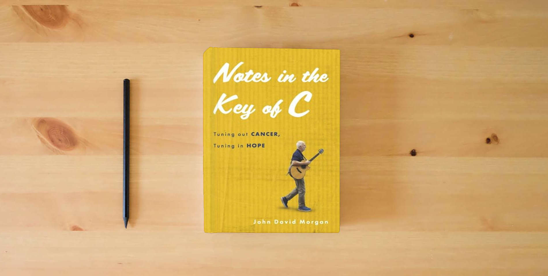 The book Notes in the Key of C: Tuning out Cancer, Tuning in Hope is on the table