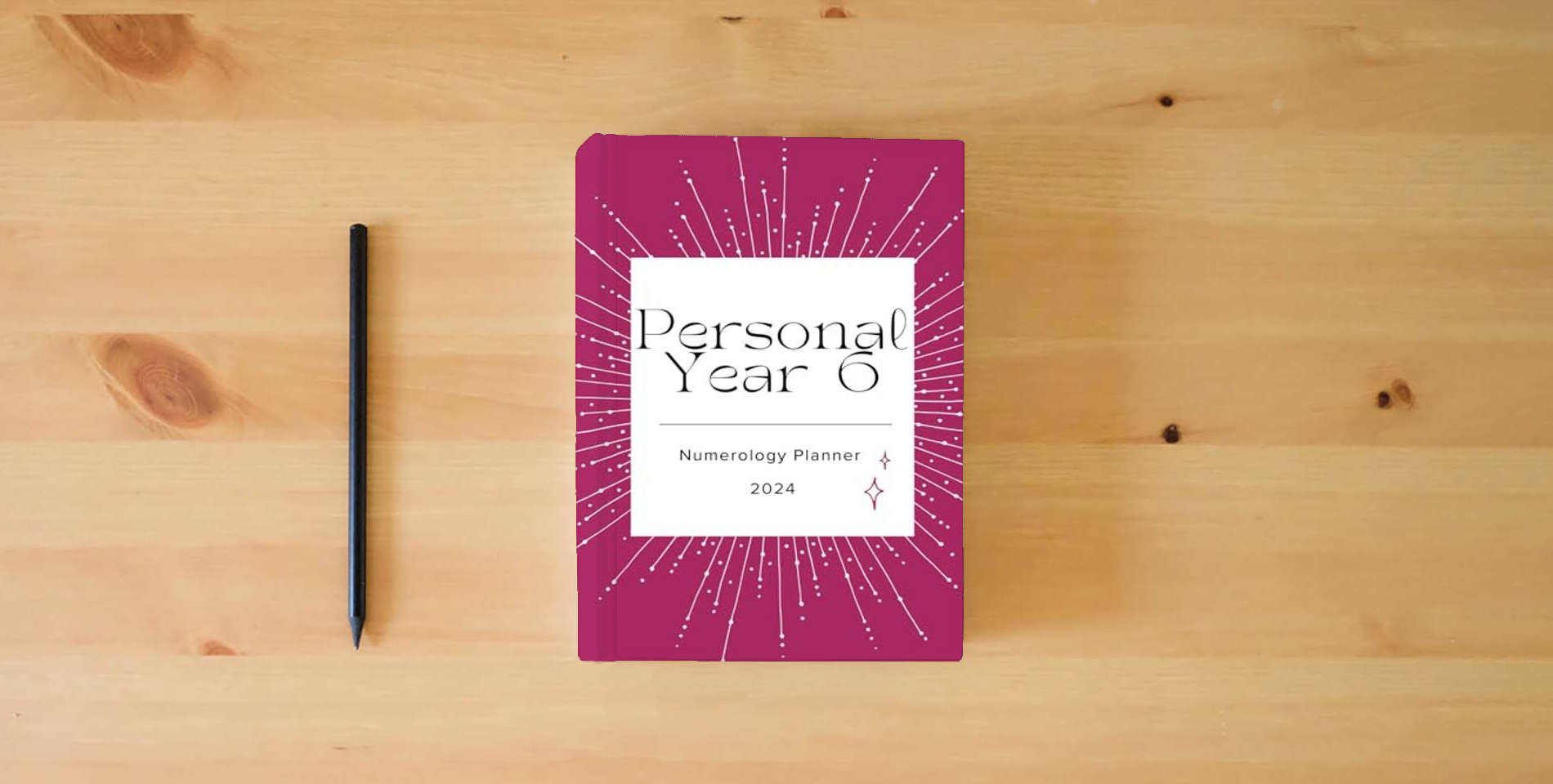 The book Numerology Planner 2024: Year 6 is on the table