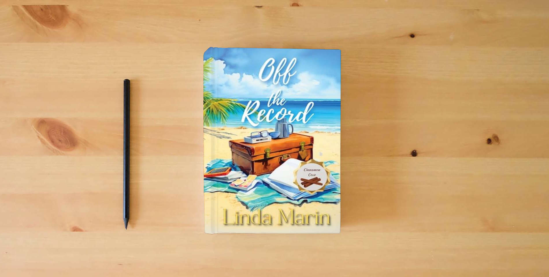 The book Off the Record: A Clean Contemporary Small Town Romance (Cinnamon Cove) is on the table