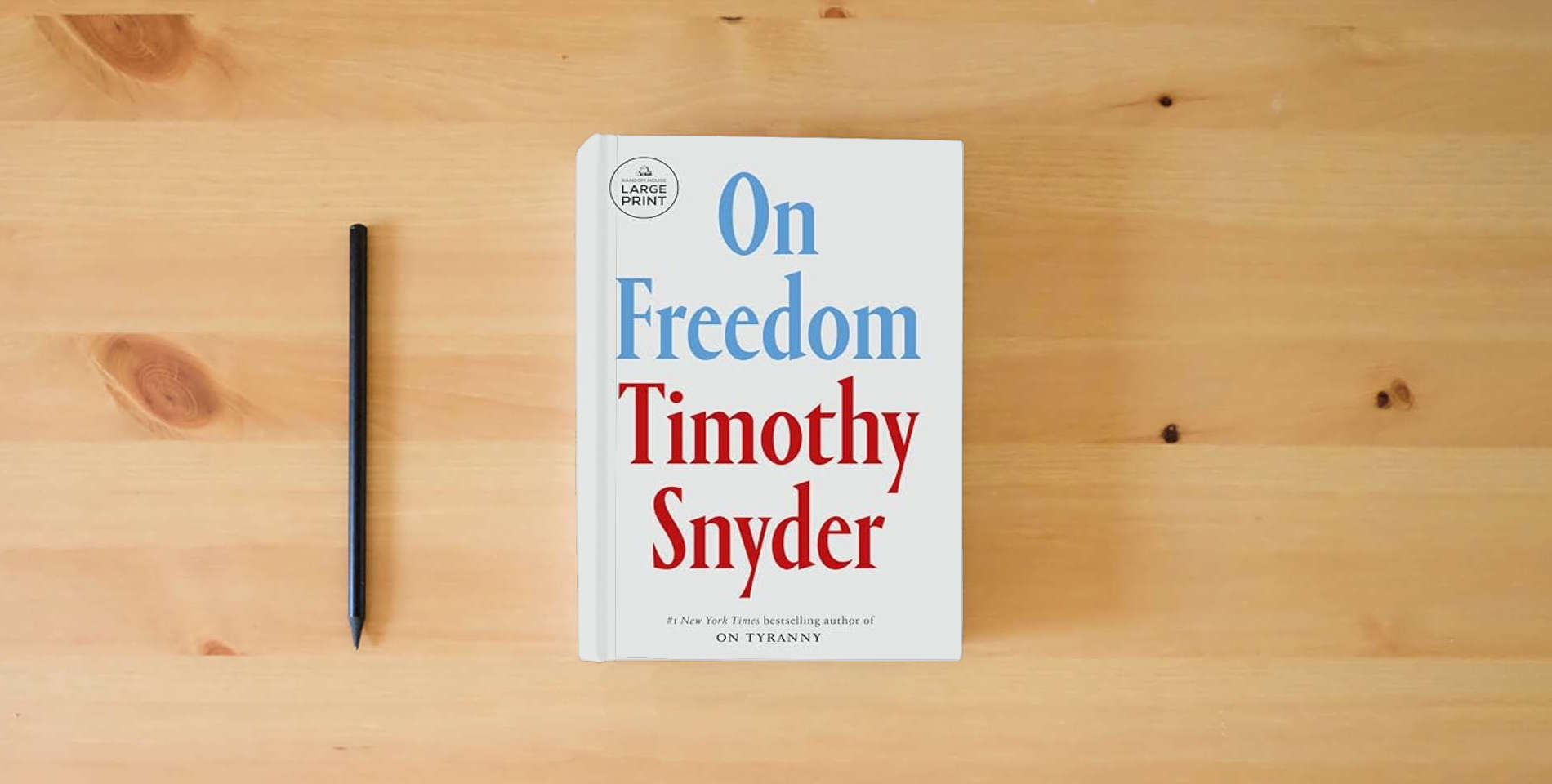 The book On Freedom is on the table