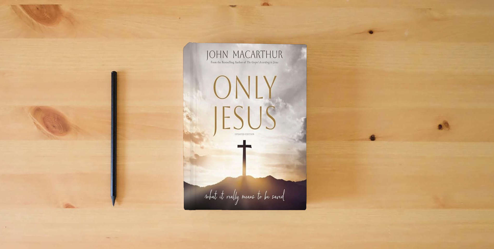 The book Only Jesus, Updated Edition: What It Really Means to Be Saved is on the table