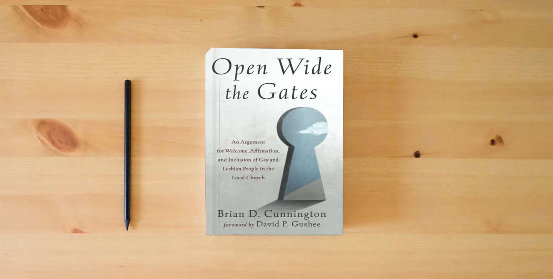 The book Open Wide the Gates: An Argument for Welcome, Affirmation, and Inclusion of Gay and Lesbian People in the Local Church is on the table