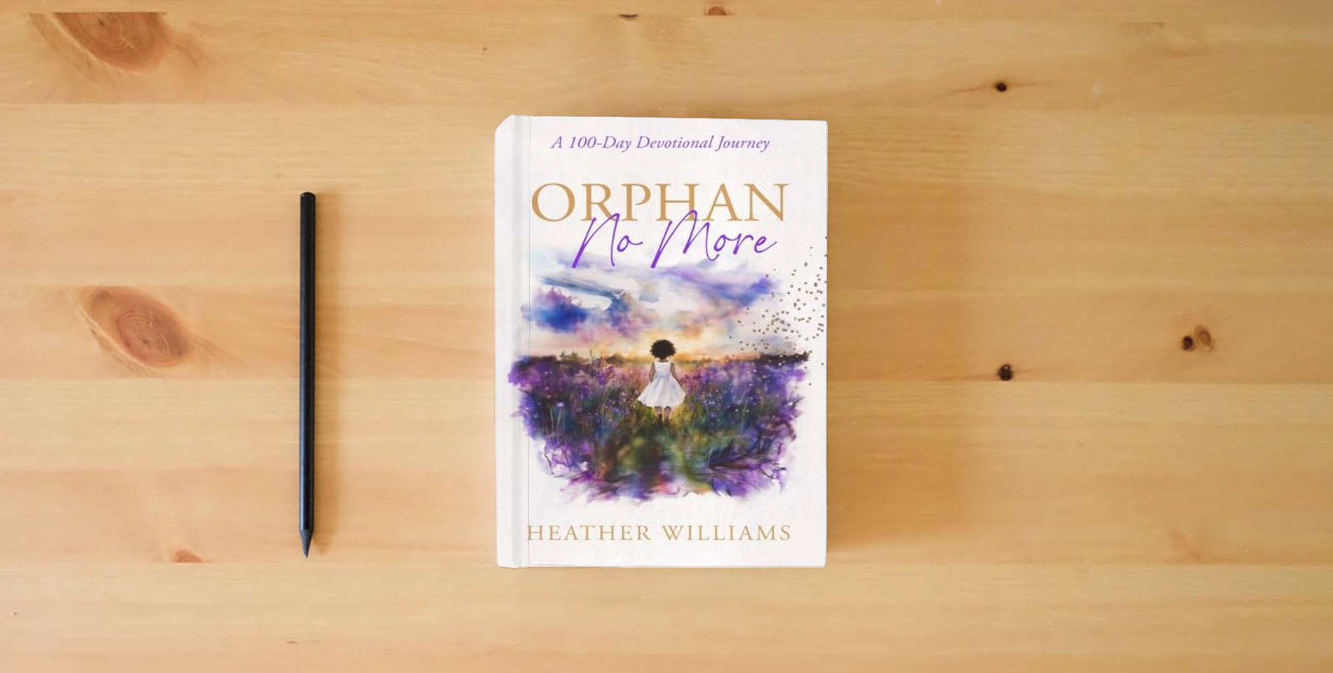 The book Orphan No More: A 100-Day Devotional Journey is on the table