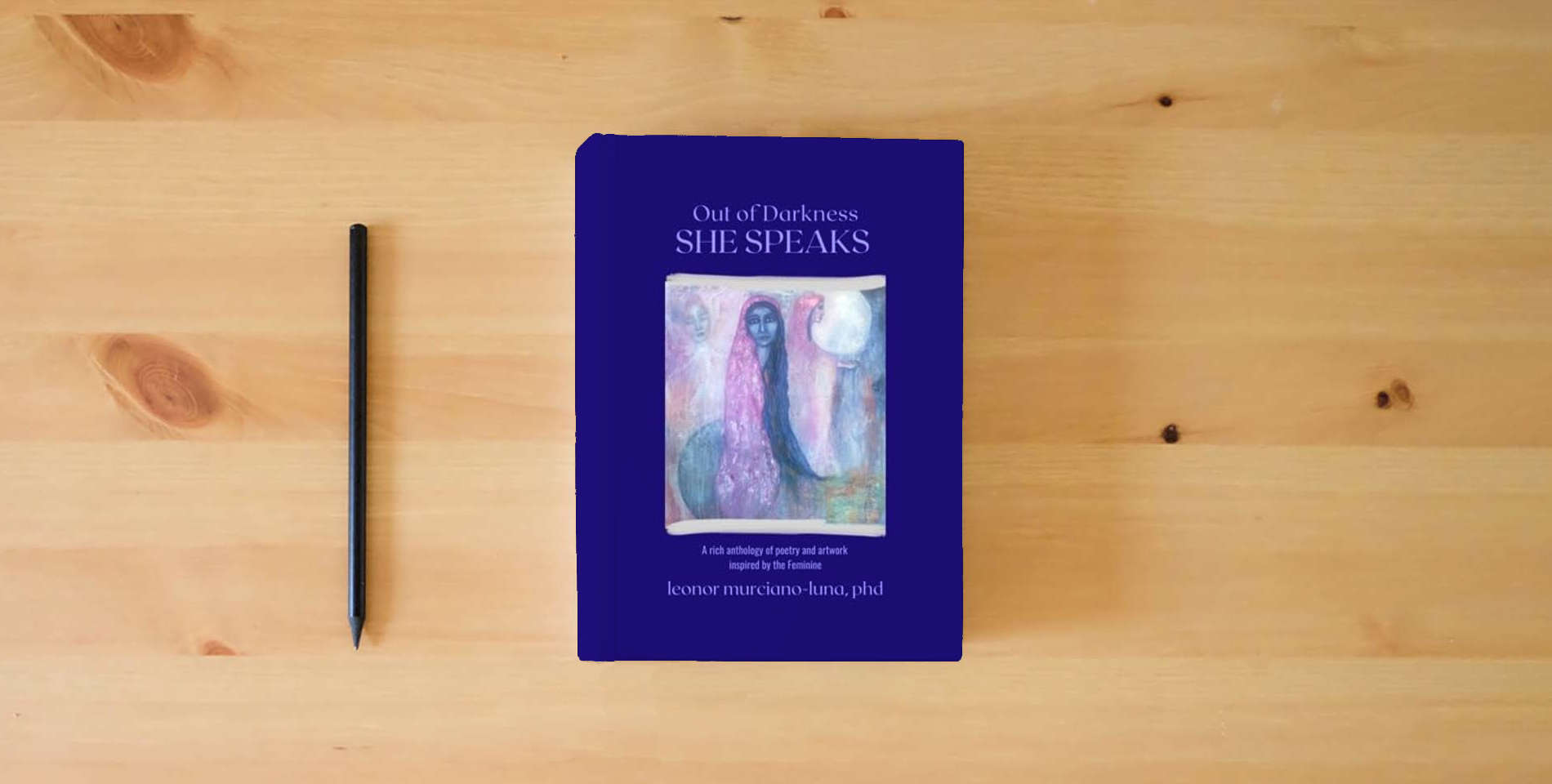 The book Out of Darkness SHE SPEAKS is on the table