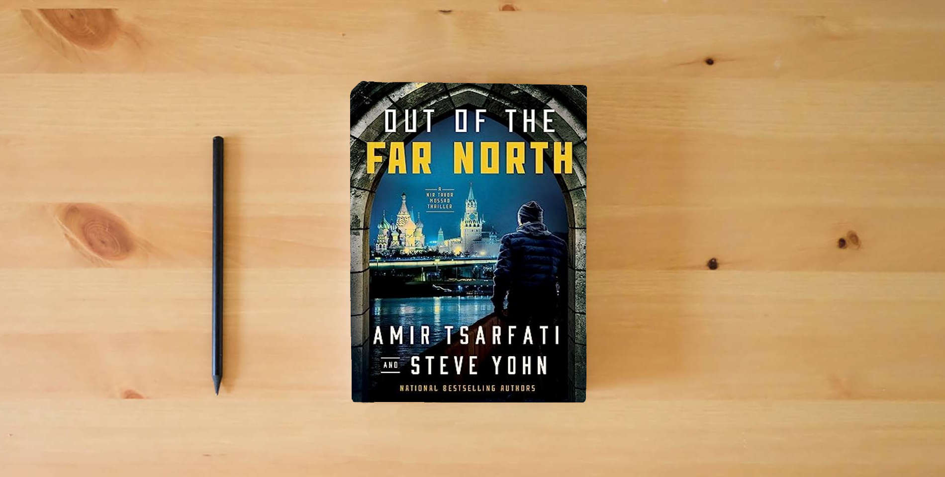 The book Out of the Far North (A Nir Tavor Mossad Thriller) is on the table