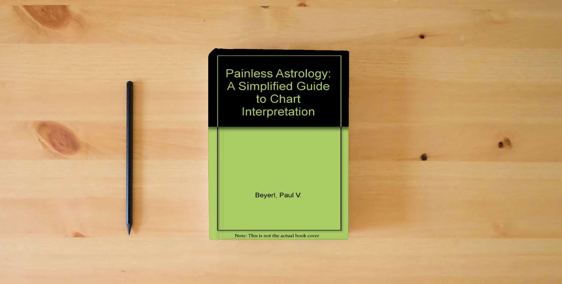 The book Painless Astrology: A Simplified Guide to Chart Interpretation is on the table