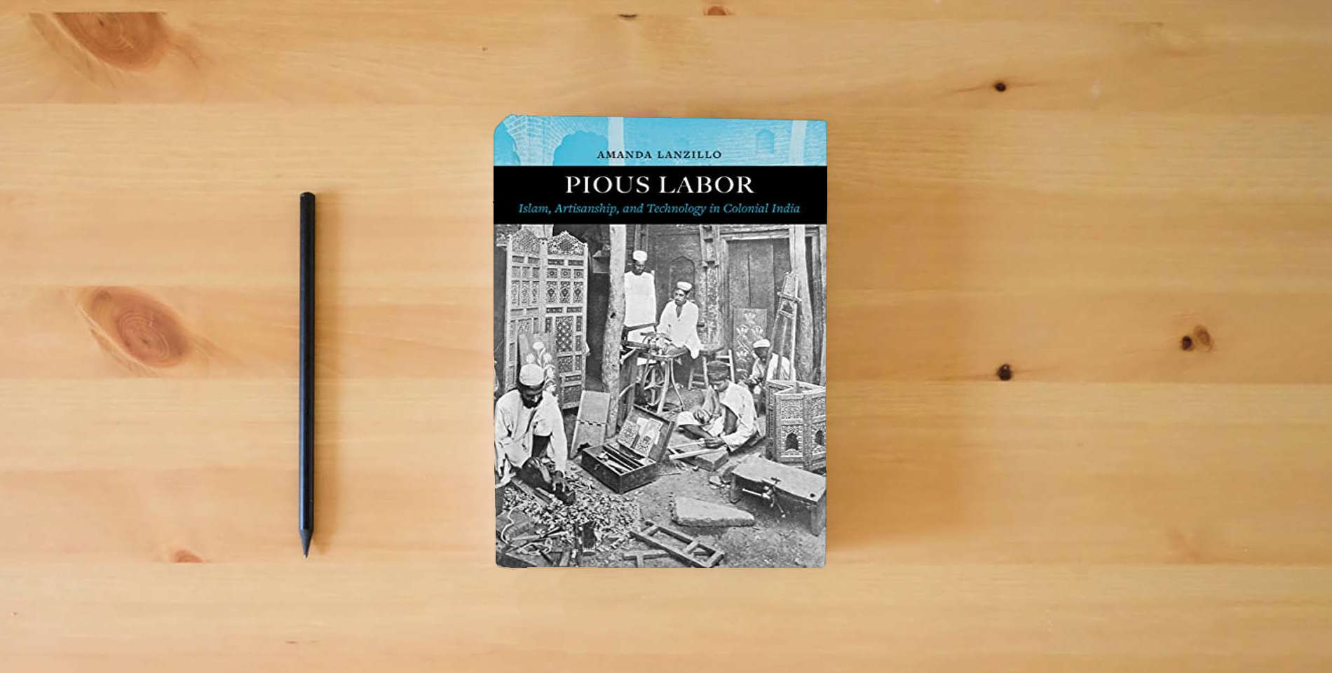 The book Pious Labor: Islam, Artisanship, and Technology in Colonial India (Volume 5) (Islamic Humanities) is on the table