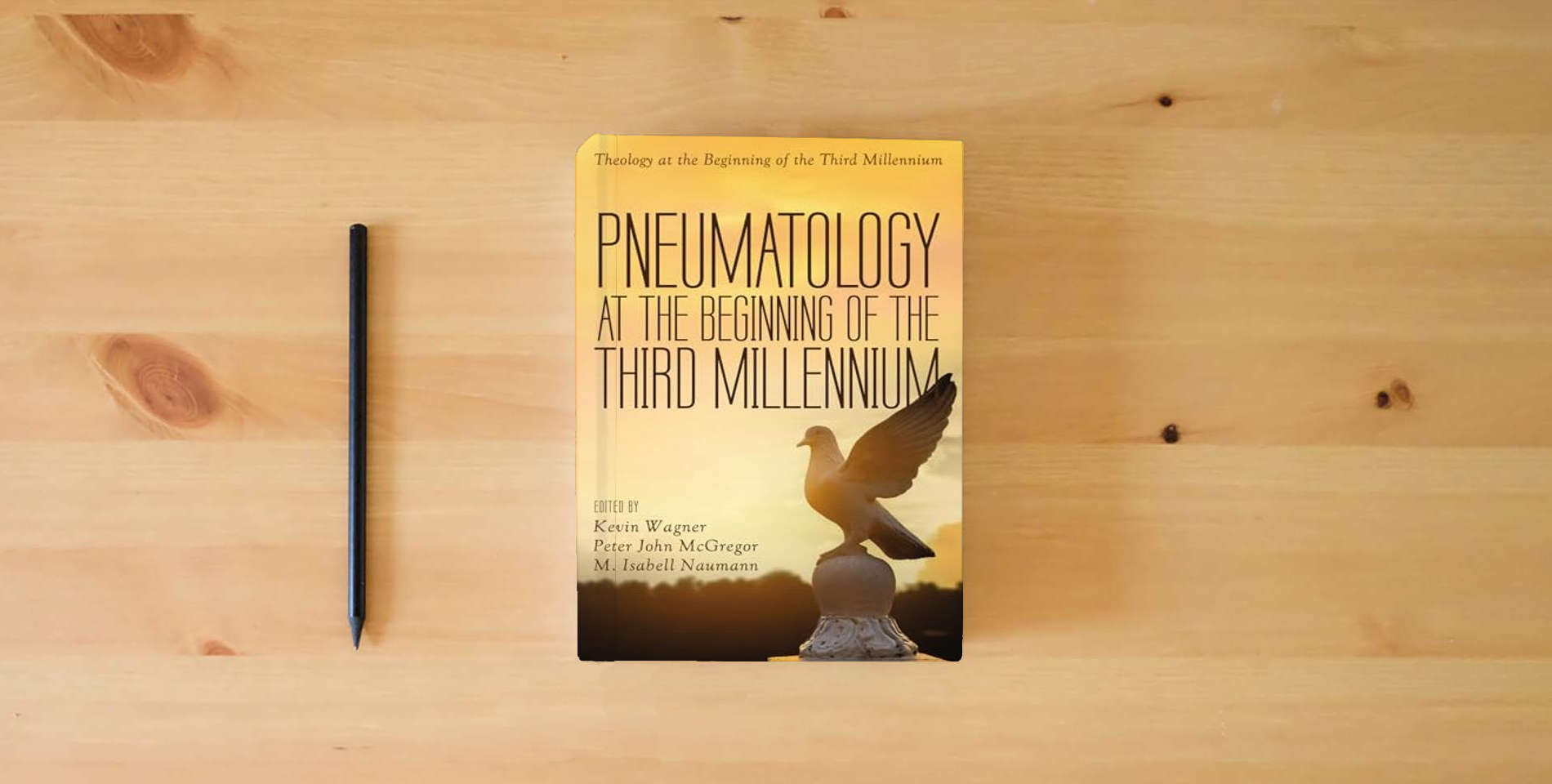 The book Pneumatology at the Beginning of the Third Millennium (Theology at the Beginning of the Third Millennium) is on the table