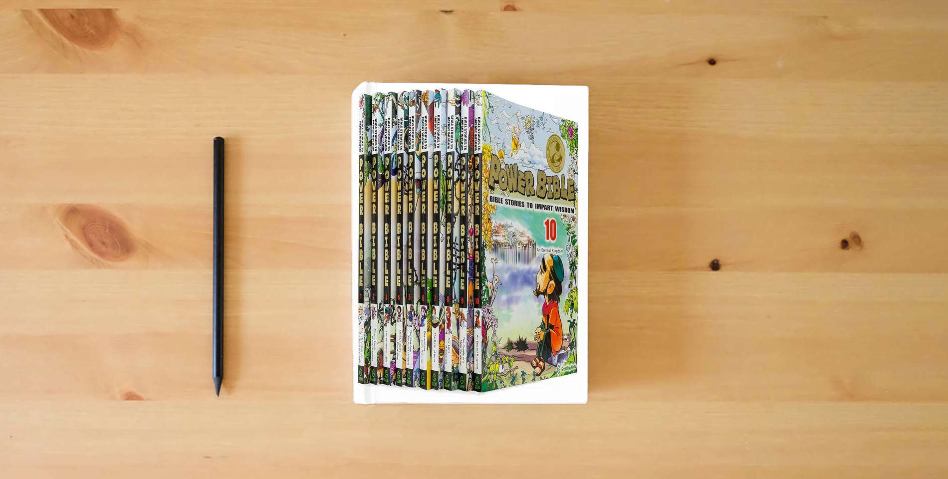 The book Power Bible: Bible Stories To Impart Wisdom Complete Set (10 Books) is on the table