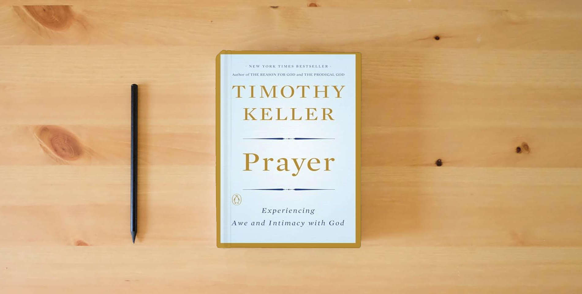 The book Prayer: Experiencing Awe and Intimacy with God is on the table