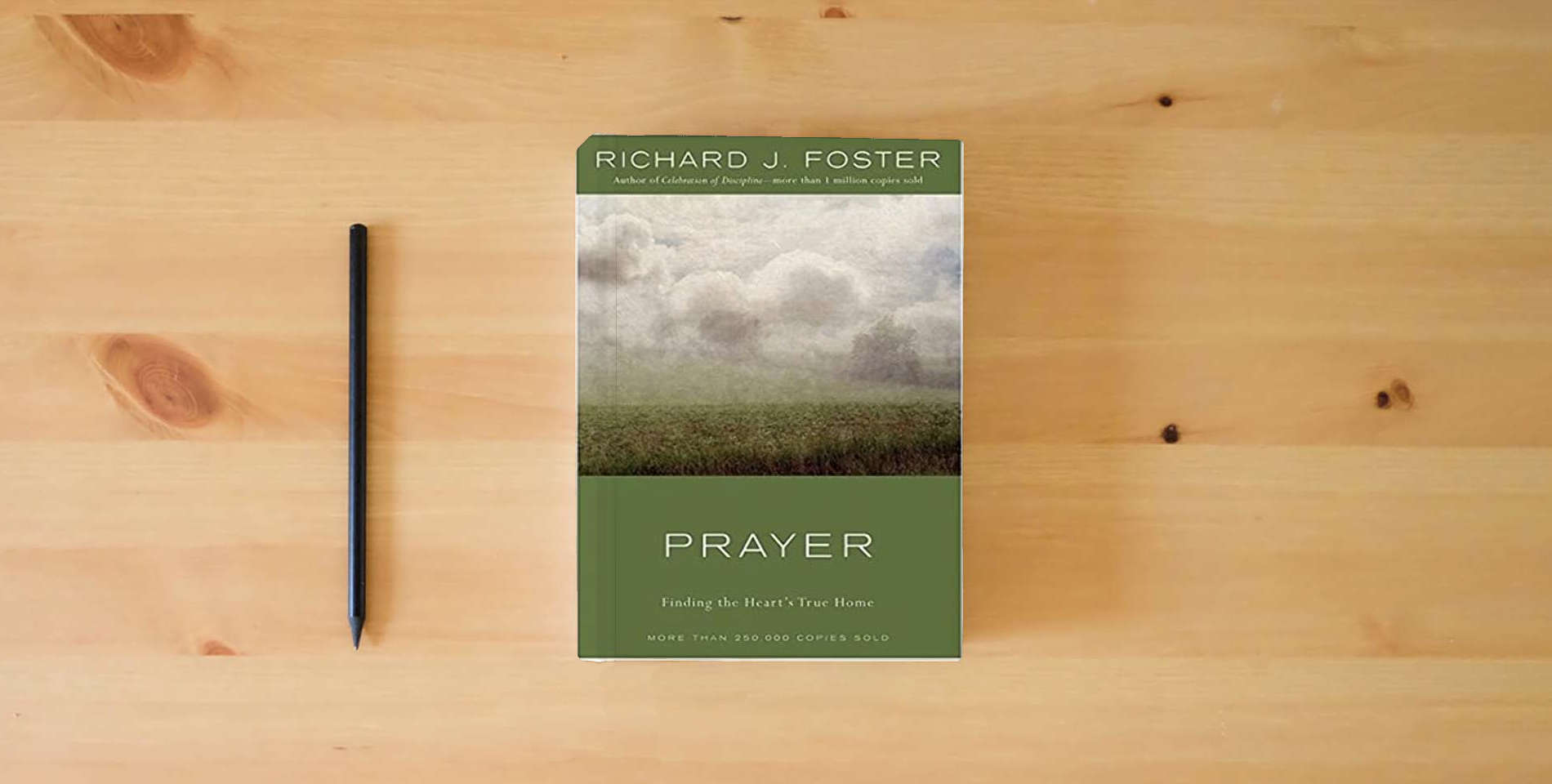 The book Prayer: Finding the Heart's True Home is on the table