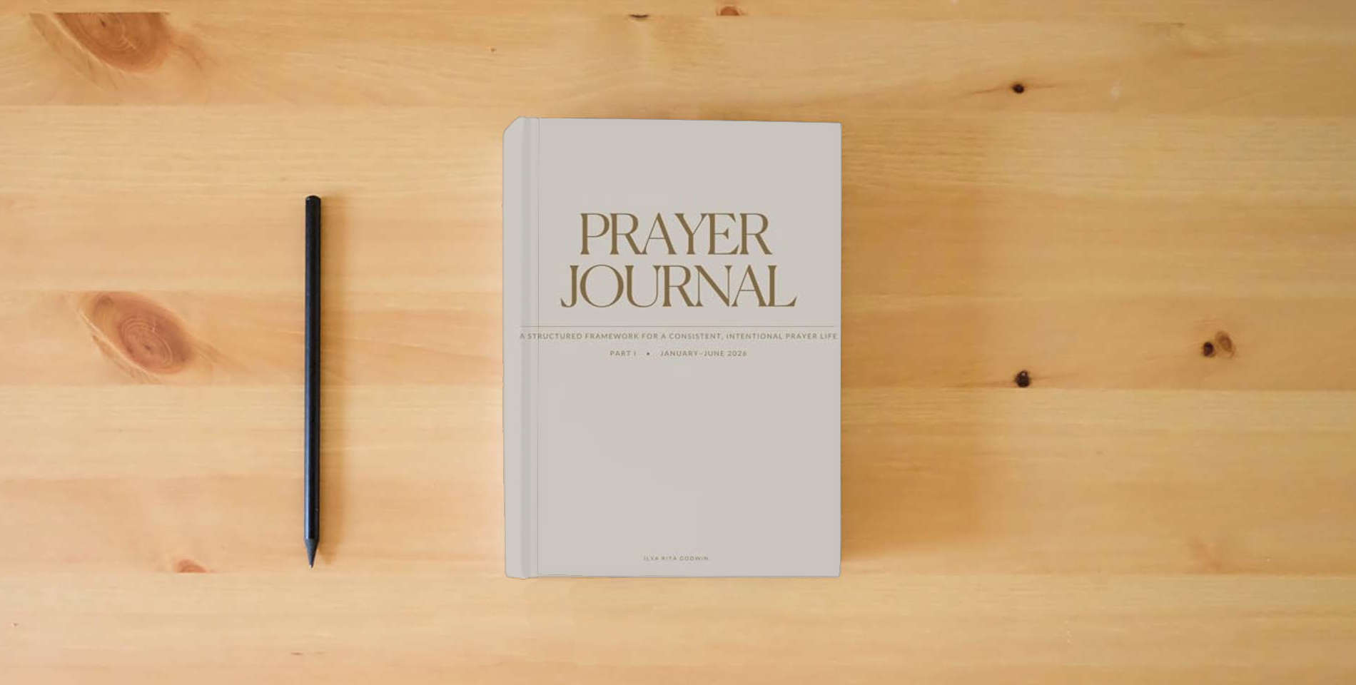 The book PRAYER JOURNAL: A Structured Framework for a Consistent, Intentional Prayer Life is on the table