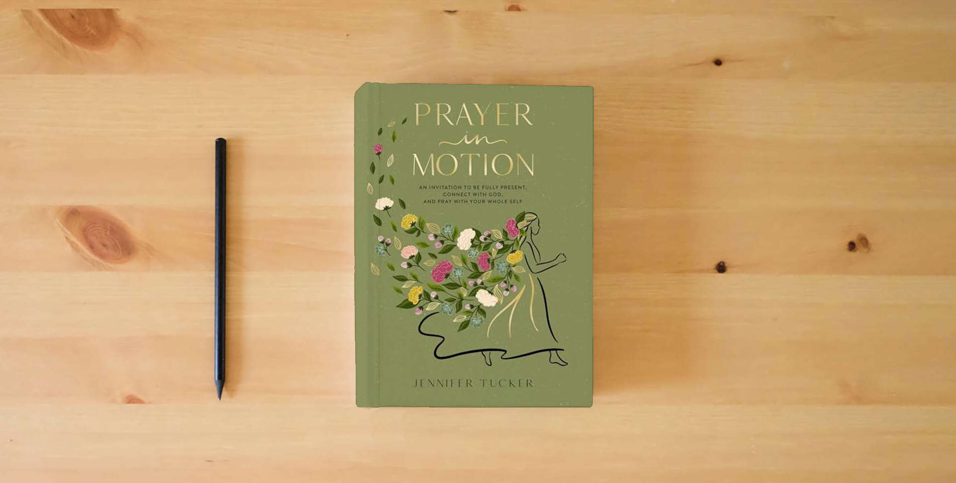 The book Prayer in Motion: An Invitation to Be Fully Present, Connect with God, and Pray with Your Whole Self is on the table