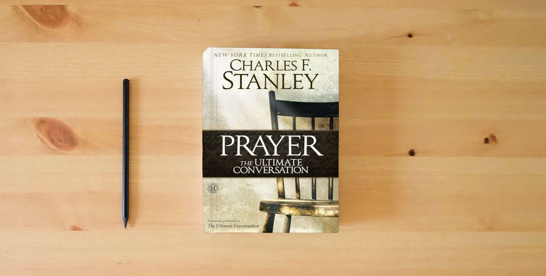 The book Prayer: The Ultimate Conversation is on the table