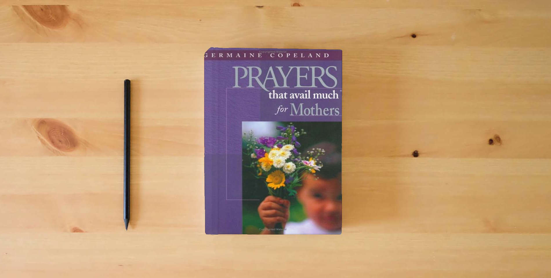 The book Prayers That Avail Much for Mothers: James 5:16 is on the table