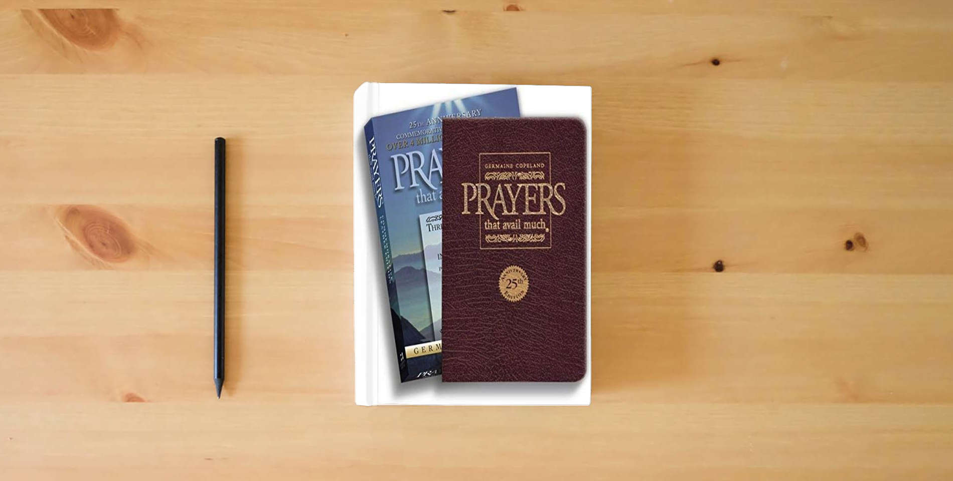 The book Prayers That Avail Much: Three Bestselling Works Complete in One Volume, 25th Anniversary Leather Burgundy (Commemorative Leather Edition) is on the table