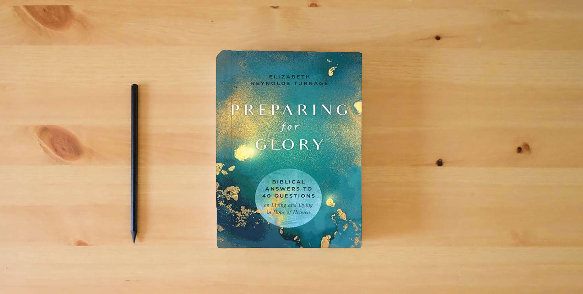 The book Preparing for Glory: Biblical Answers to 40 Questions on Living and Dying in Hope of Heaven is on the table