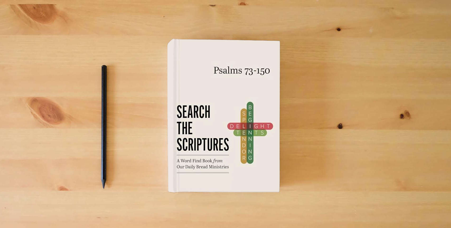 The book Psalms 73-150: A Word Find Book from Our Daily Bread Ministries (Search the Scriptures) is on the table