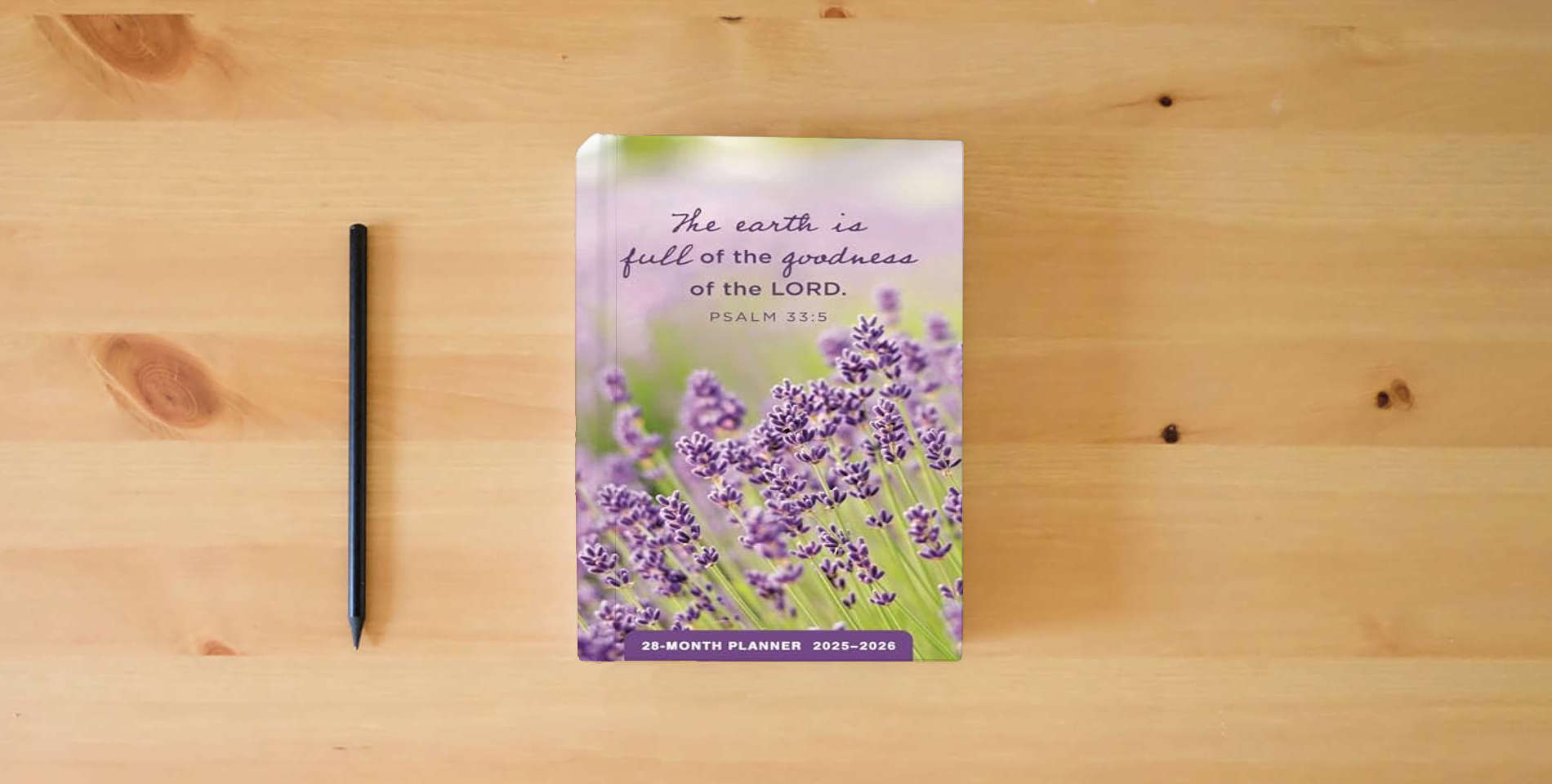 The book Psalms: 2025-2026 28-Month Inspirational Pocket Planner is on the table