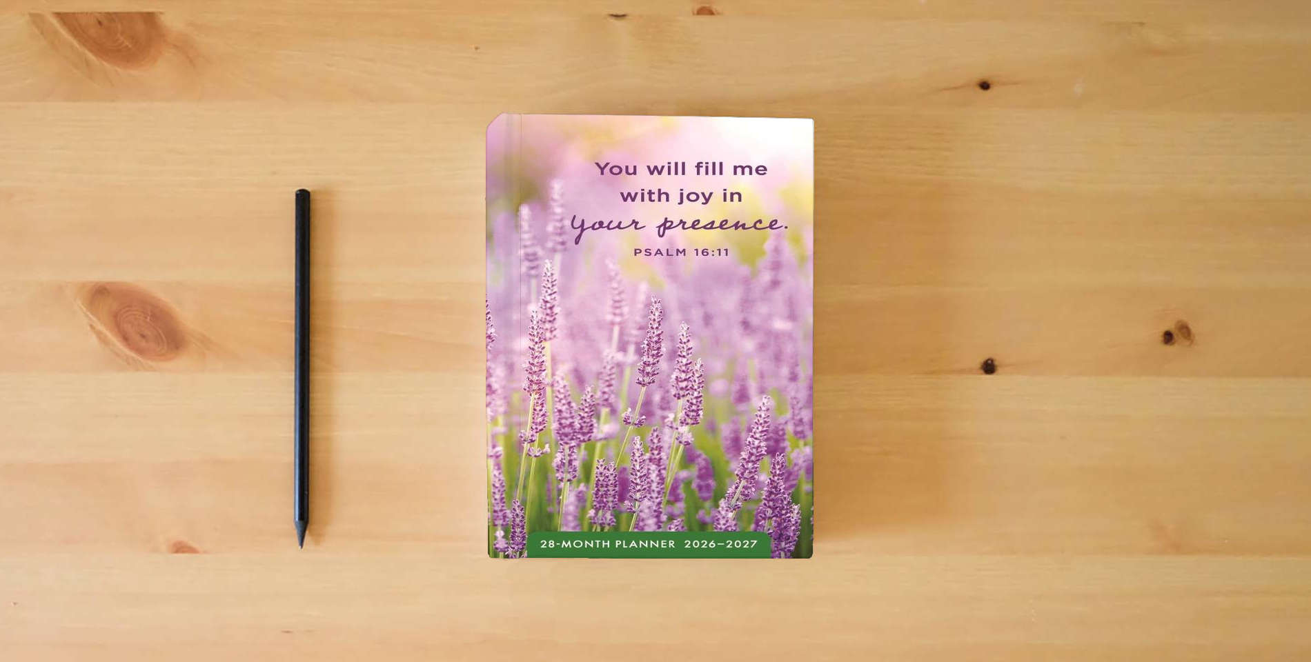 The book Psalms Floral 28-Month Inspirational Pocket Planner 2026-2027, 2-Year Calendar is on the table