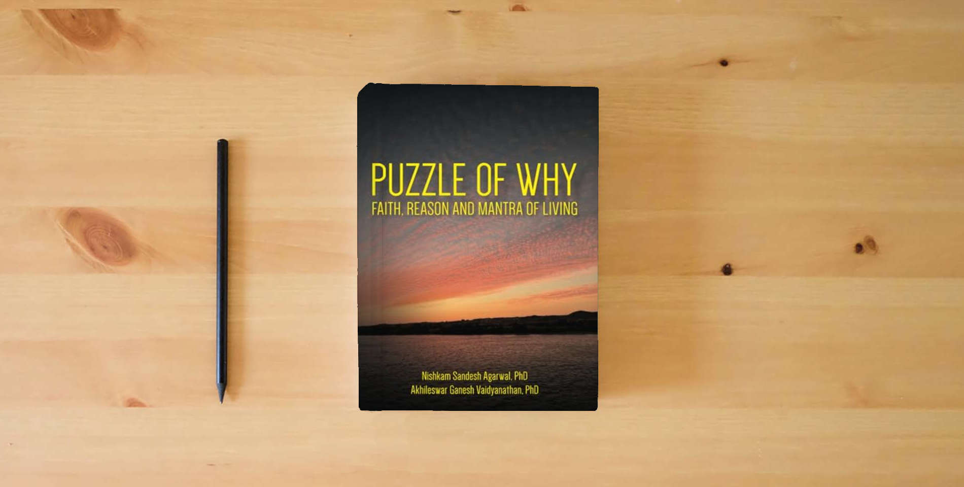 The book Puzzle of Why: Faith, Reason and Mantra of Living is on the table
