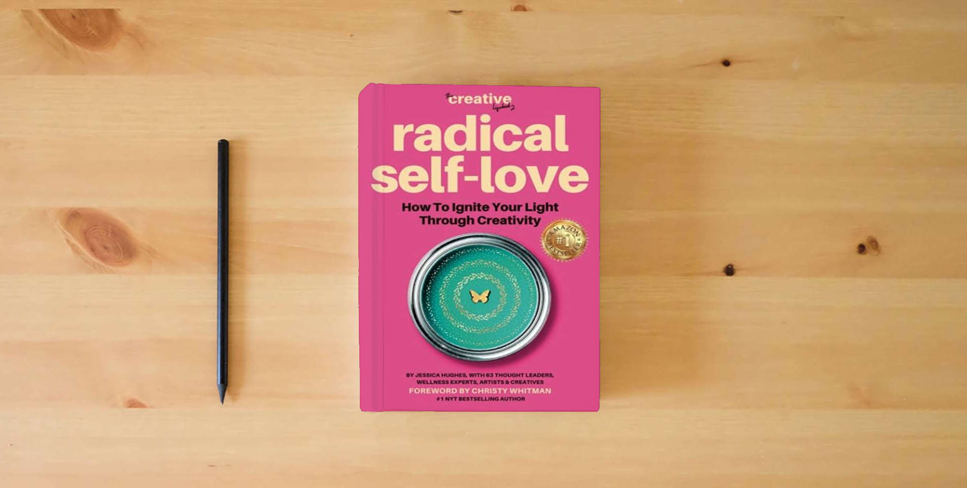 The book Radical Self Love: How To Ignite Your Light Through Creativity (The Creative Lifebook) is on the table