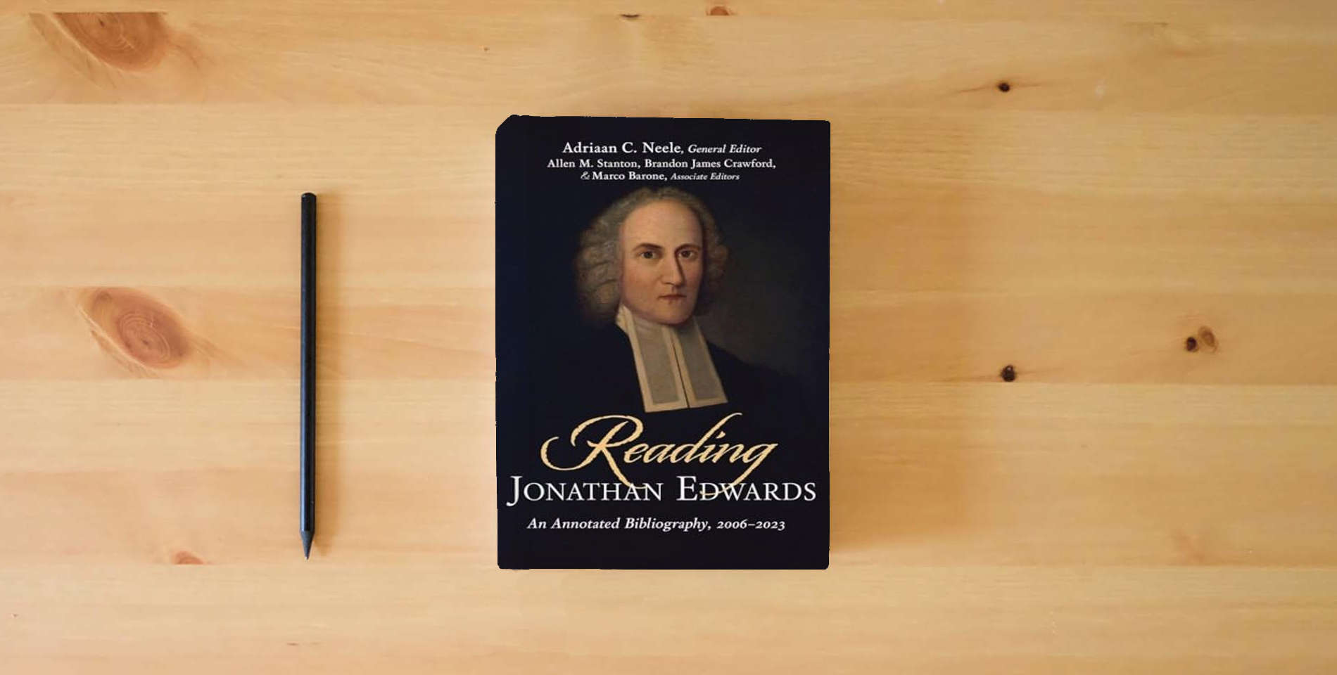 The book Reading Jonathan Edwards: An Annotated Bibliography, 2006-2023 is on the table