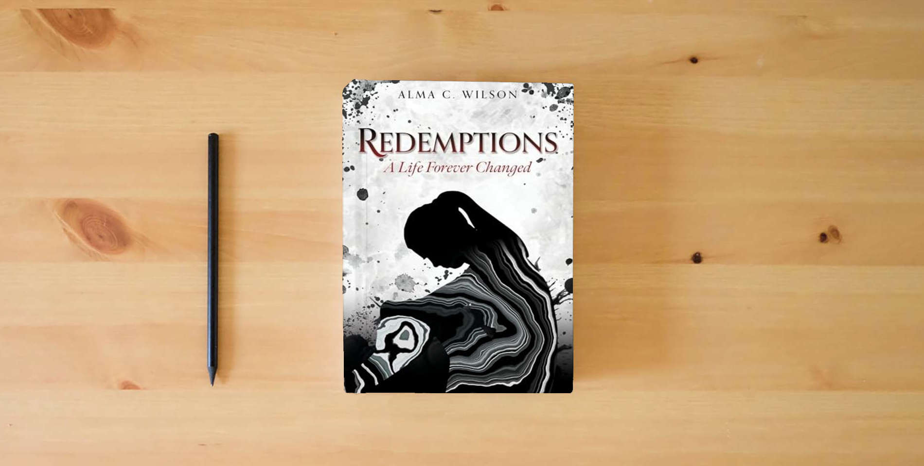 The book Redemptions: A Life Forever Changed is on the table