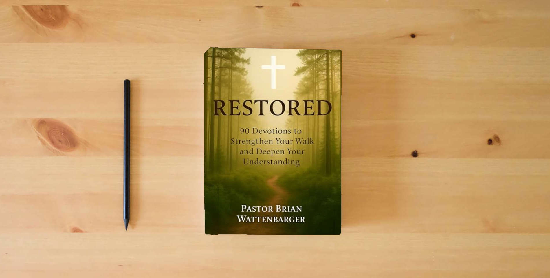 The book RESTORED: 90 Devotions to Strengthen Your Walk and Deepen Your Understanding is on the table