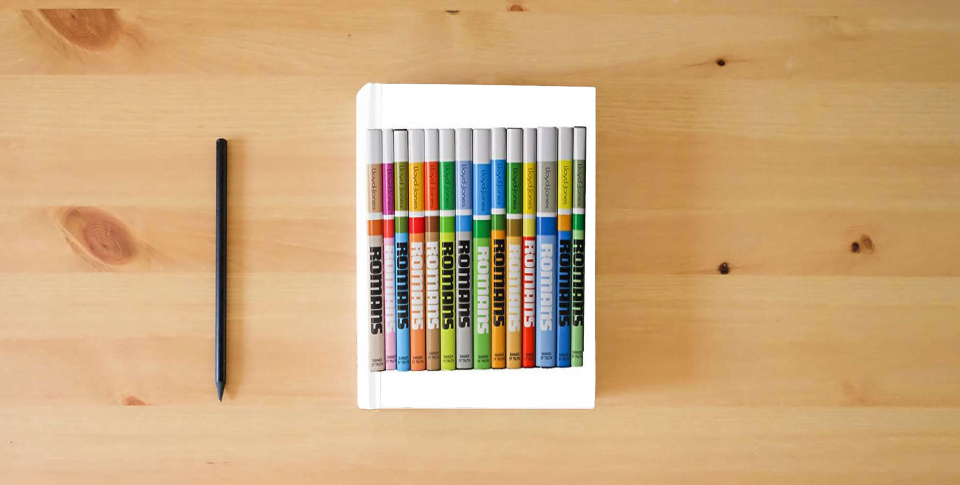 The book Romans (14 Volume Set) is on the table