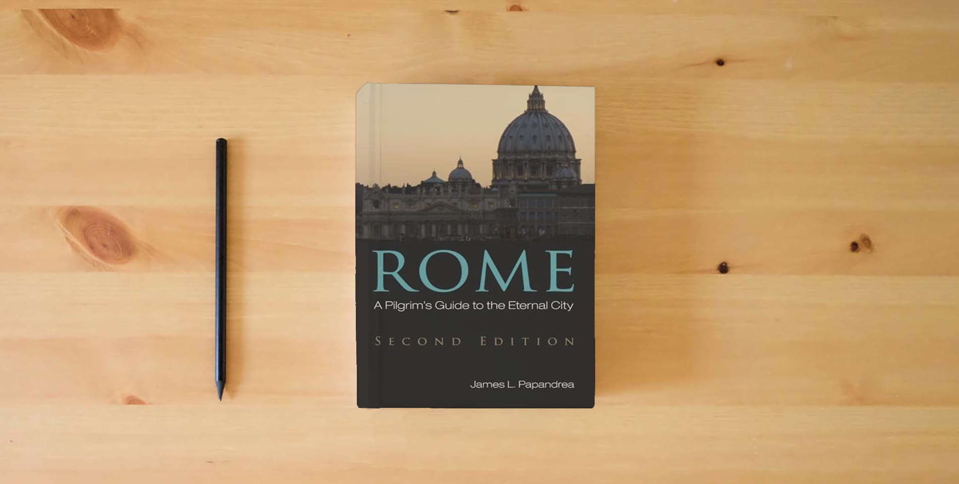 The book Rome, Second Edition: A Pilgrim's Guide to the Eternal City is on the table