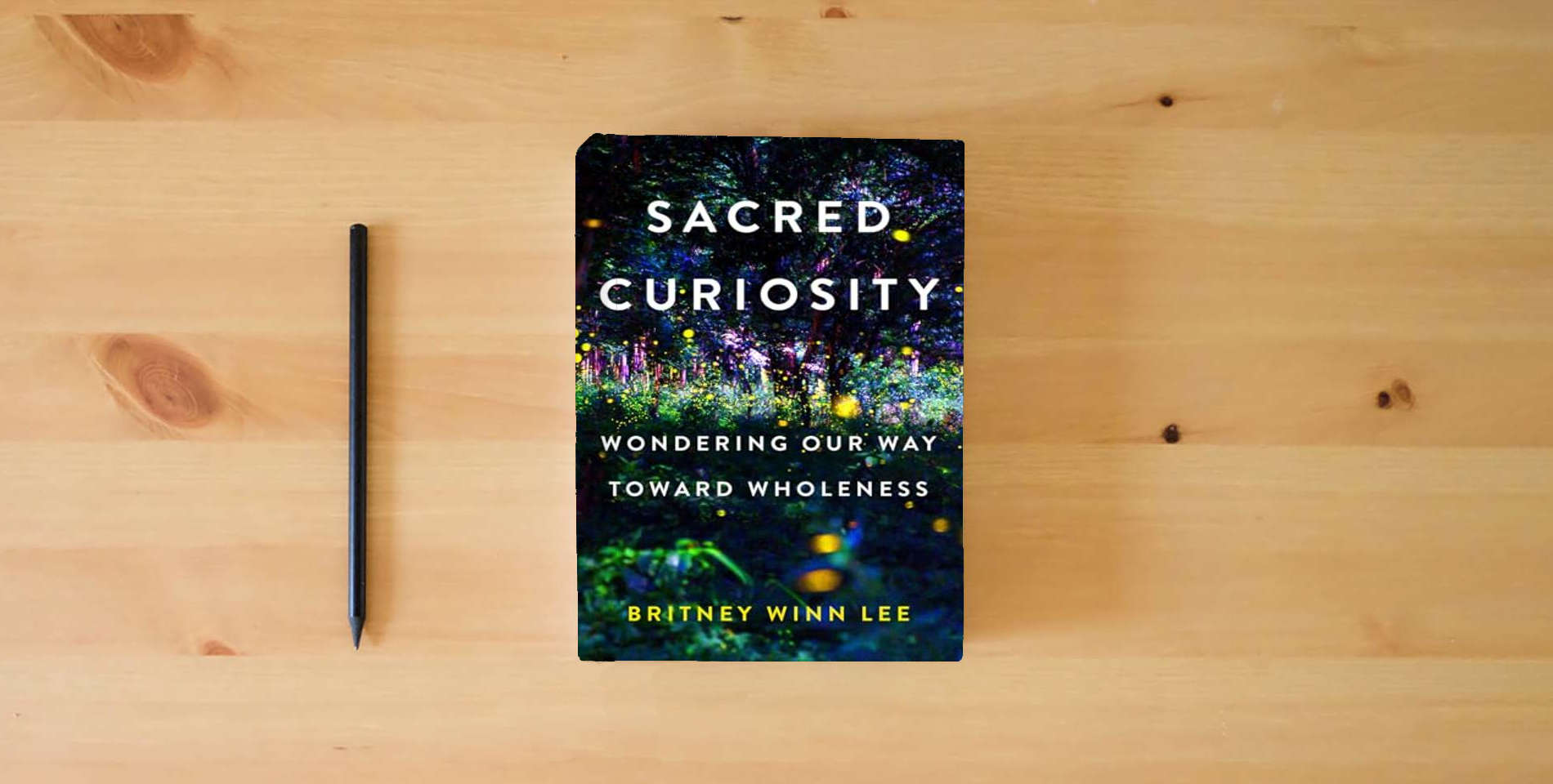 The book Sacred Curiosity: Wondering Our Way Toward Wholeness is on the table