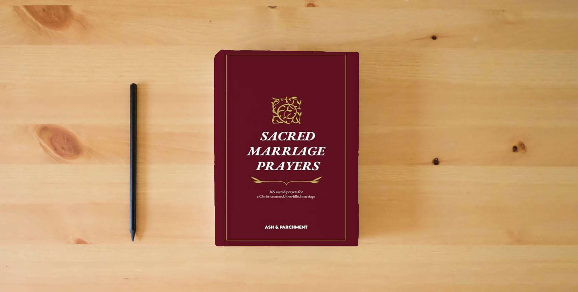The book Sacred Marriage Prayers: 365 Sacred Prayers for a Christ-centered, Love-filled Marriage is on the table