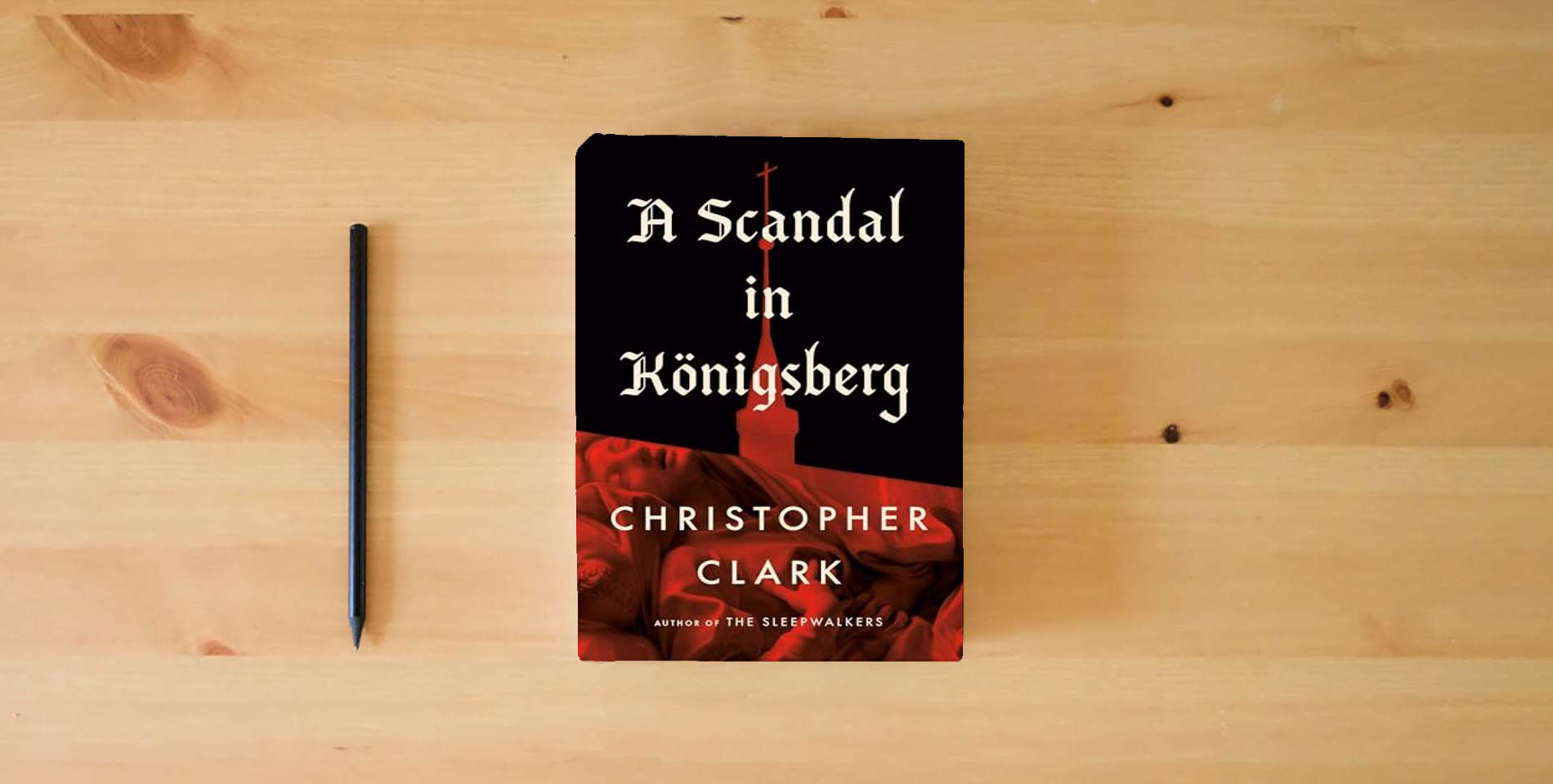 The book A Scandal in Königsberg is on the table