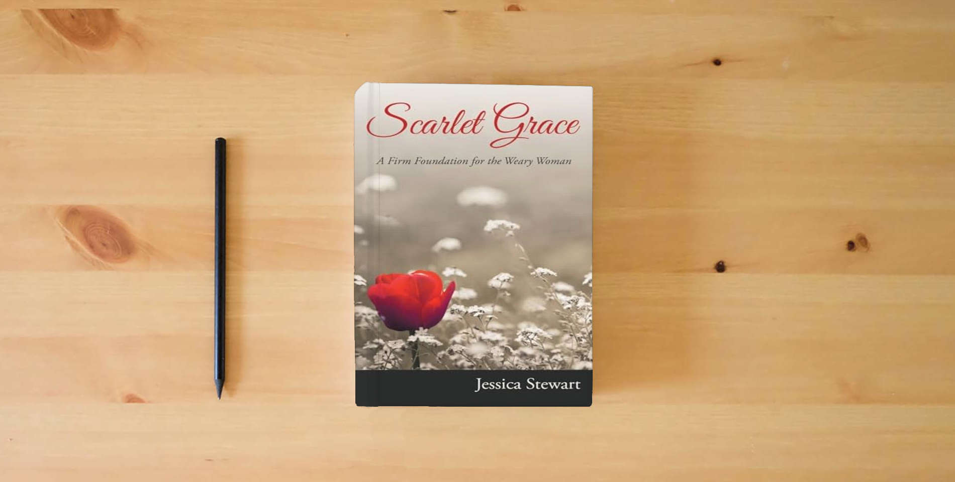 The book Scarlet Grace: A Firm Foundation for the Weary Woman is on the table