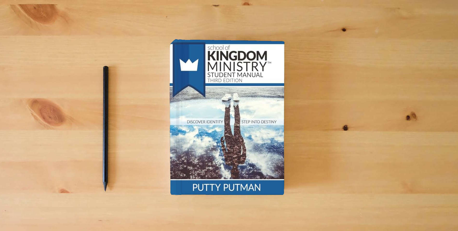 The book School of Kingdom Ministry Student Manual is on the table