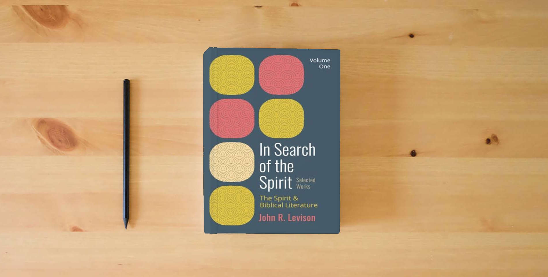 The book In Search of the Spirit: Selected Works, Volume One: The Spirit and Biblical Literature is on the table