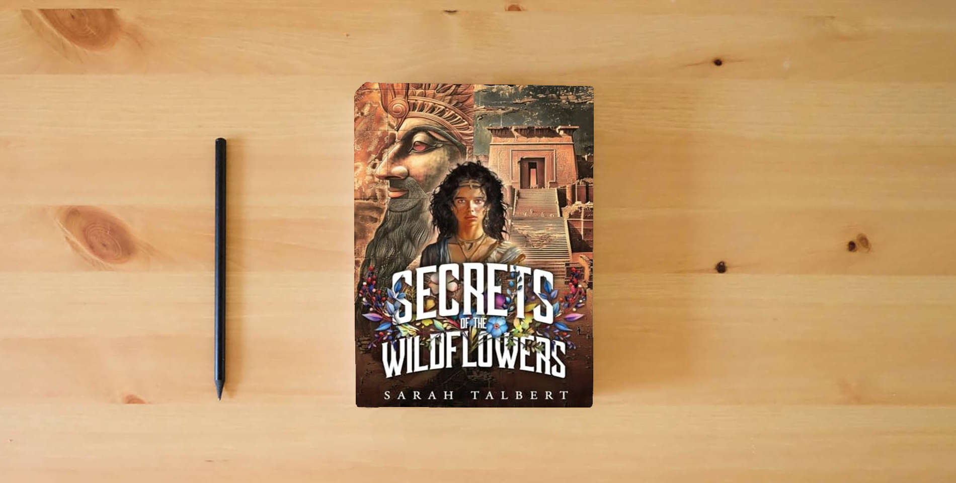 The book Secrets of the Wildflowers is on the table