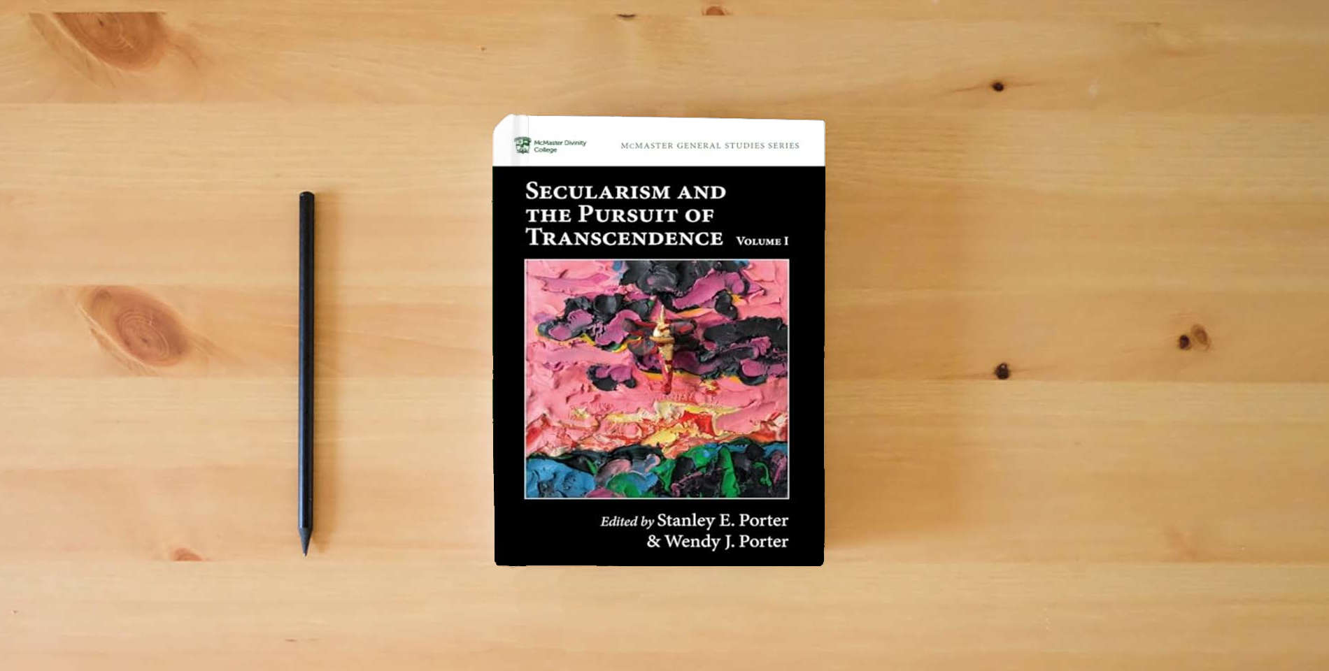 The book Secularism and the Pursuit of Transcendence, Volume I (McMaster General Studies Series) is on the table
