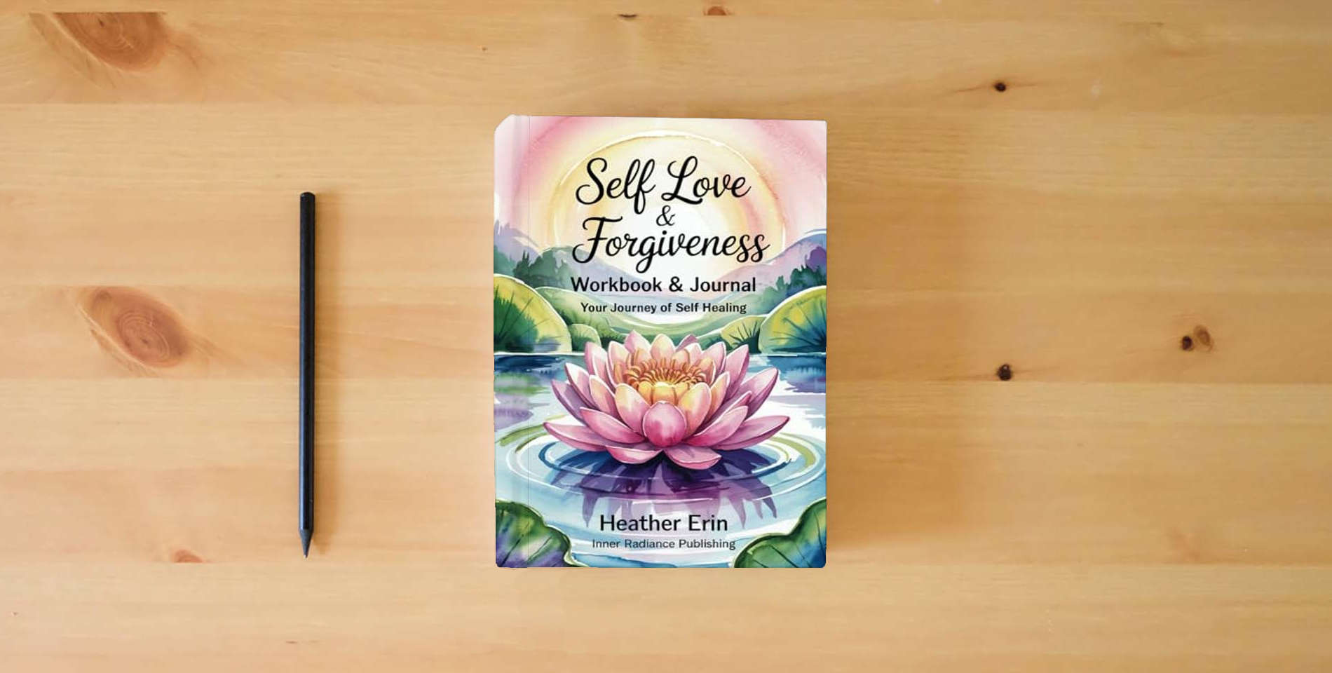 The book Self Love & Forgiveness Workbook & Journal: Your Journey of Self Healing is on the table