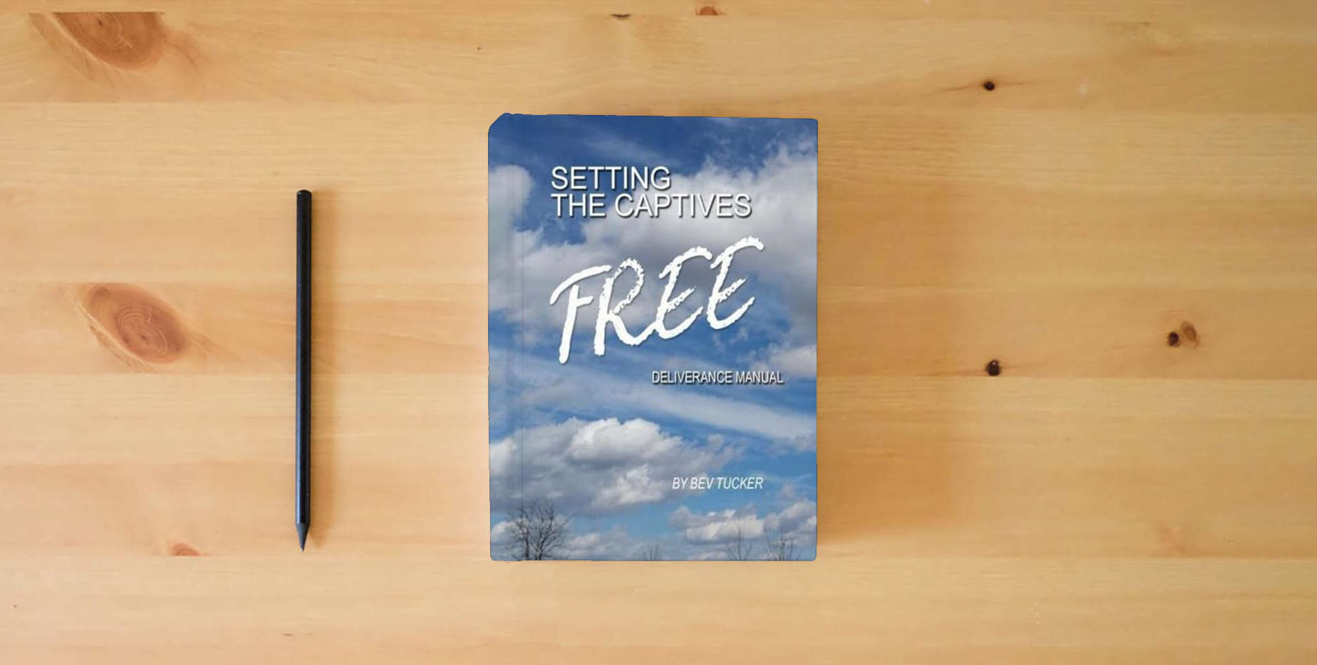 The book Setting the Captives Free: Deliverance Manual is on the table