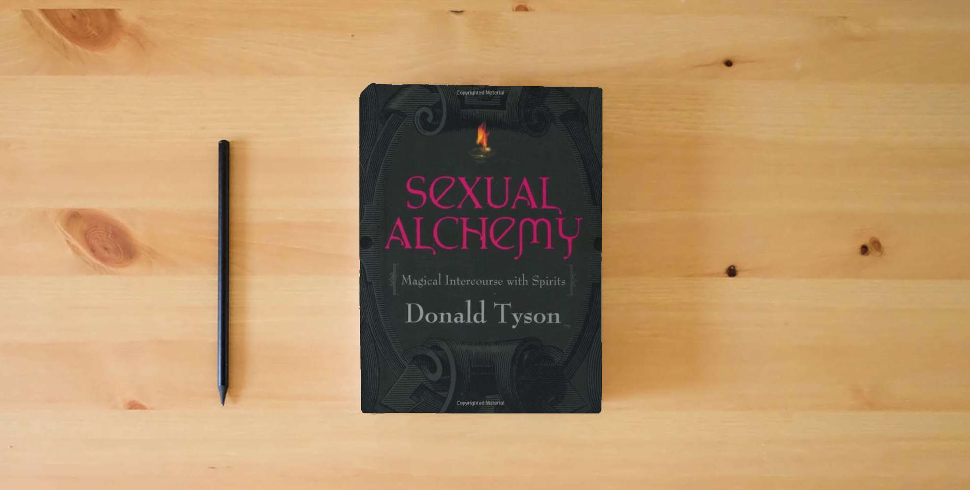 The book Sexual Alchemy: Magical Intercourse with Spirits is on the table
