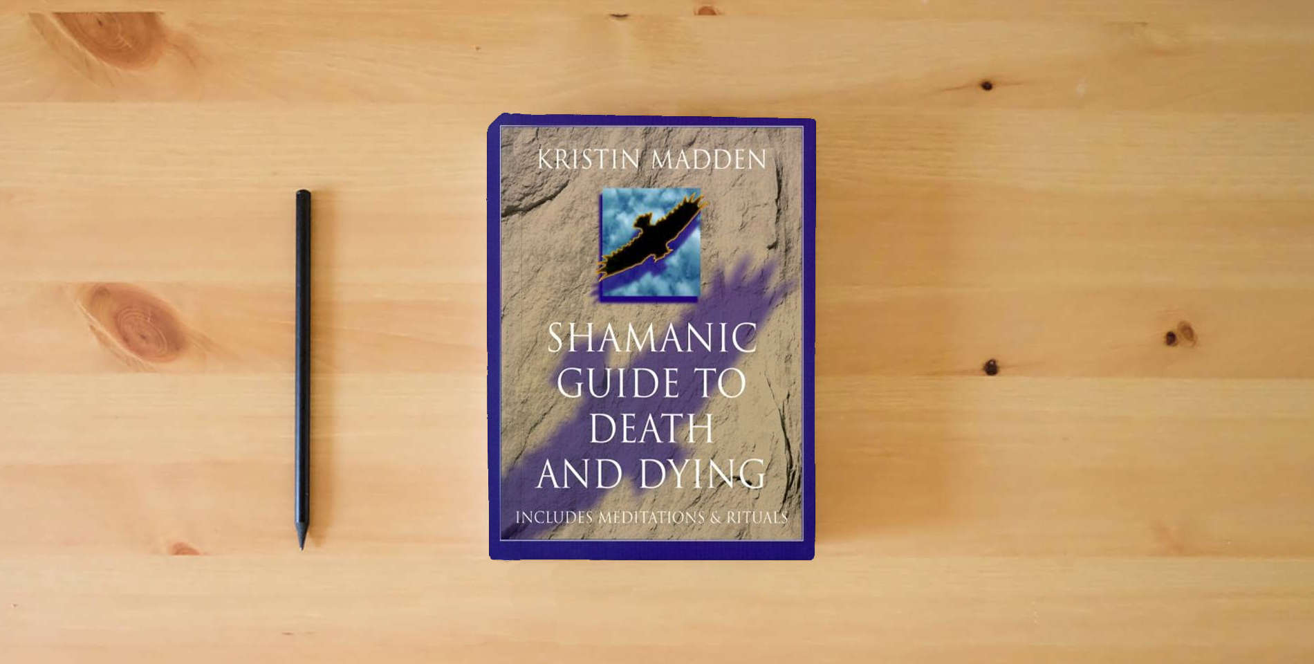 The book Shamanic Guide To Death & Dying is on the table