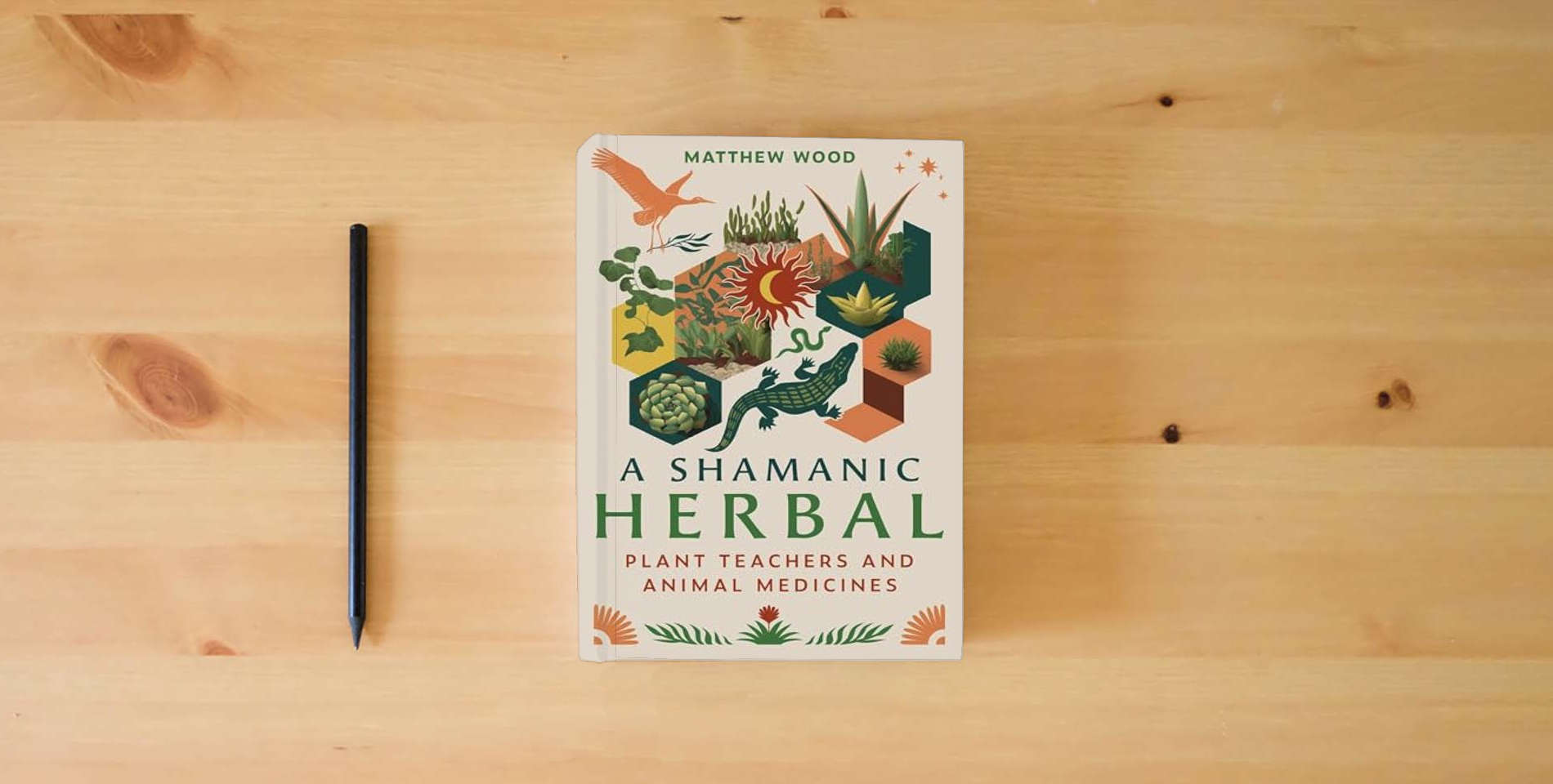 The book A Shamanic Herbal: Plant Teachers and Animal Medicines is on the table